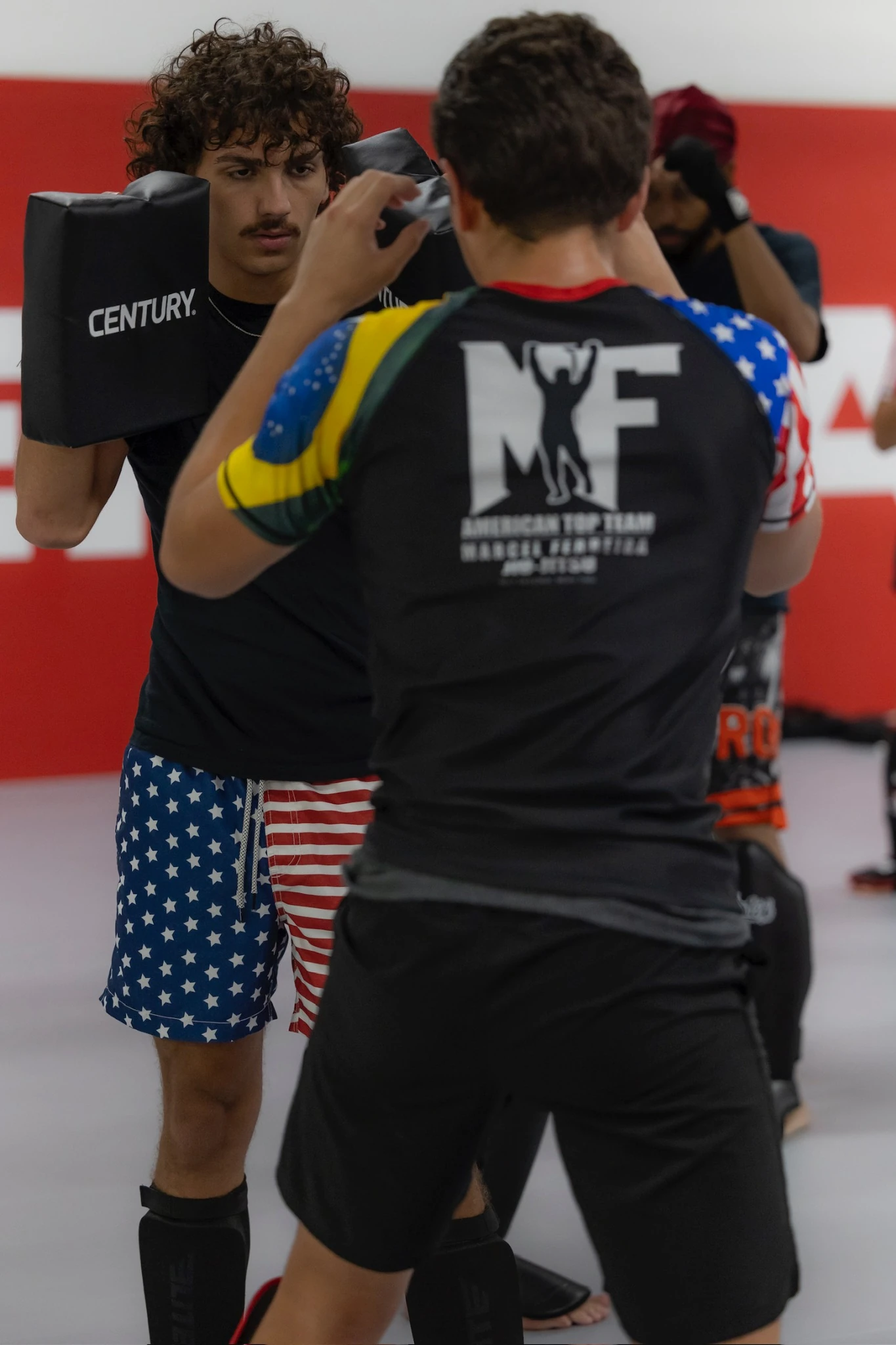 Adults training Muay Thai and boxing striking at American Top Team Winter Garden